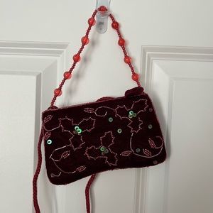 Velvet red hand bag with strap